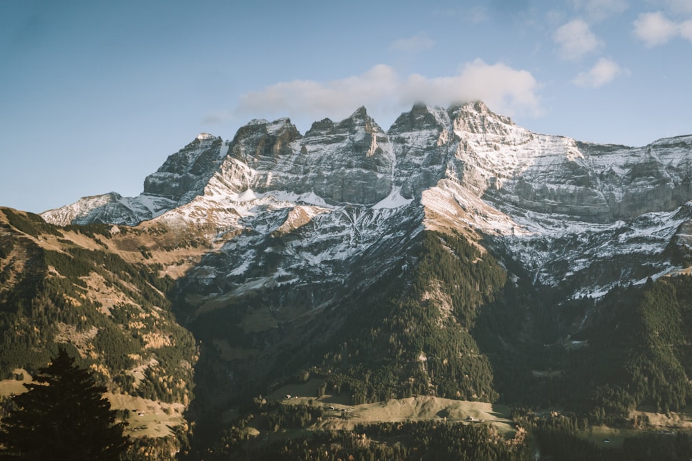 a view of a mountain range with snow on it