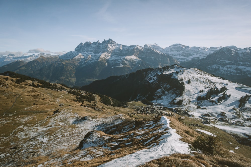 a view of a mountain range covered in snow