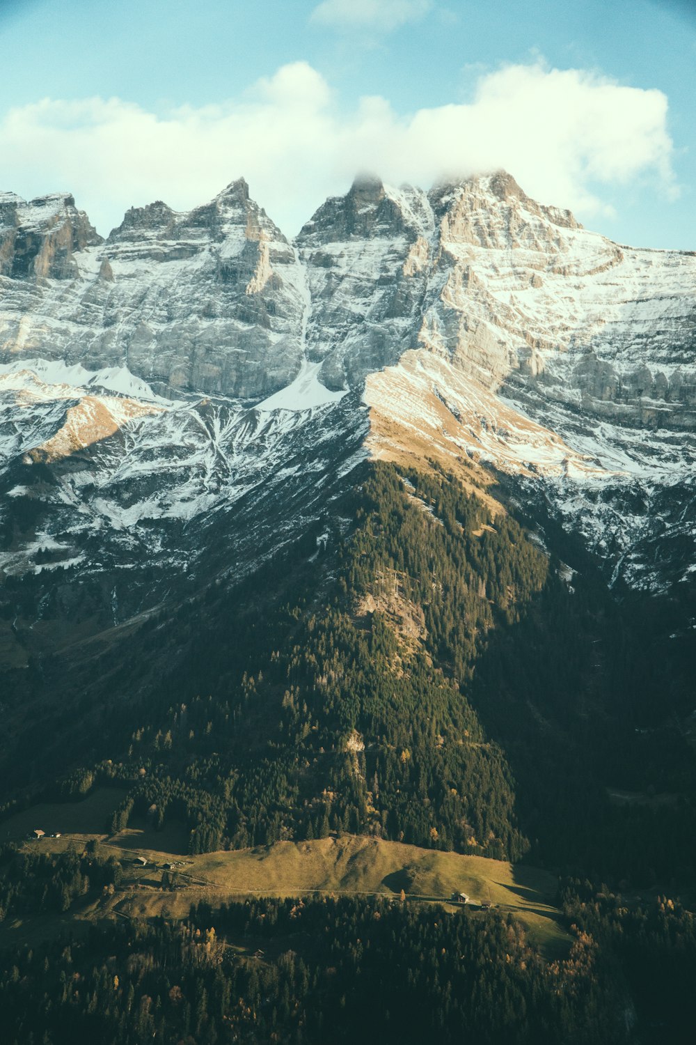 a view of a mountain range with snow on it