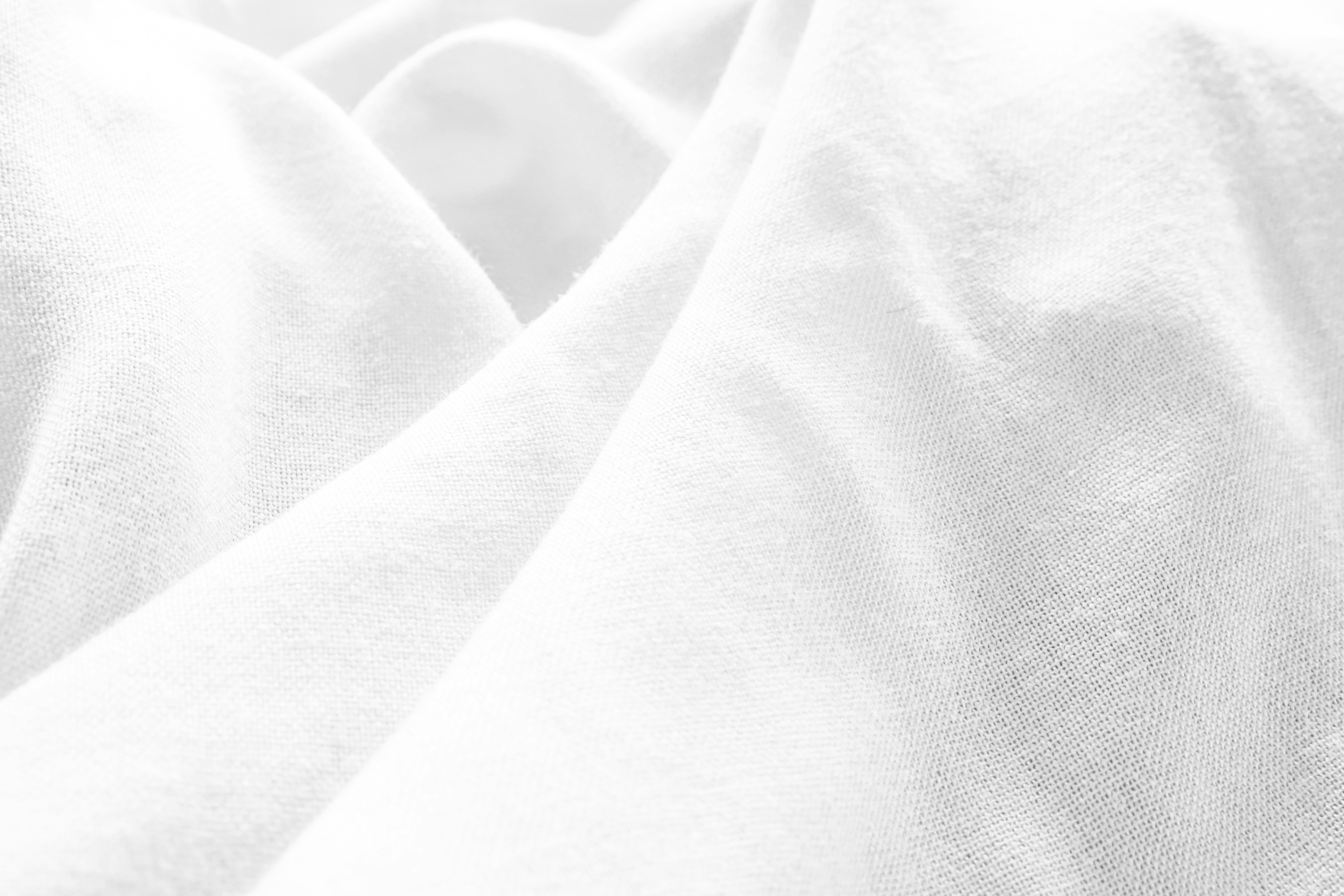 a black and white photo of a white sheet