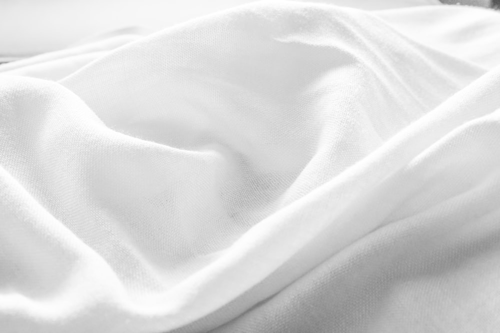 a black and white photo of a white blanket