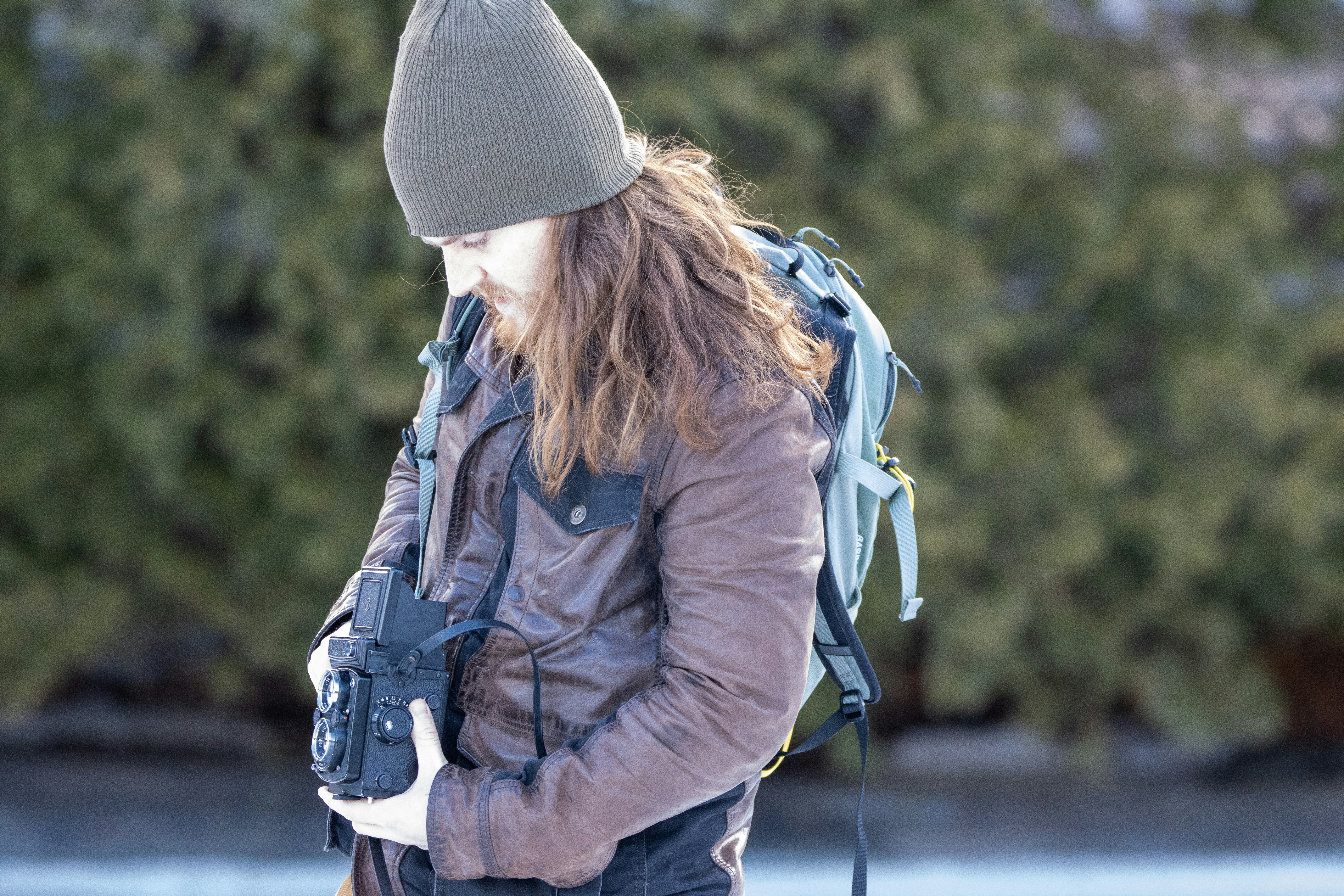 a person with a backpack and a camera
