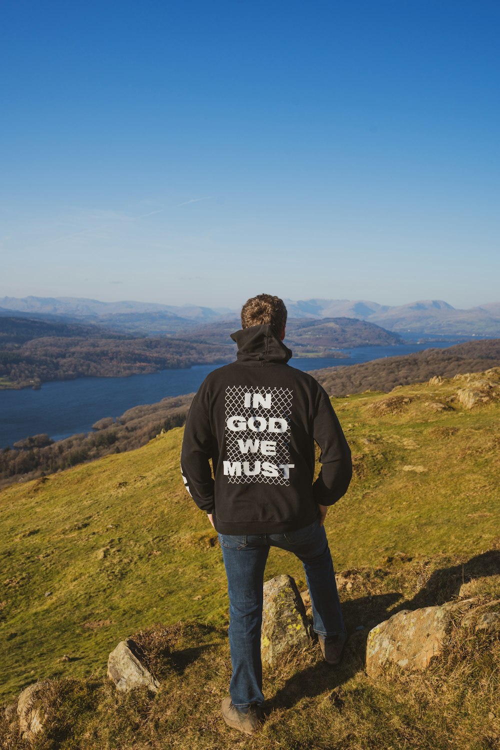 a man standing on a rocky hill