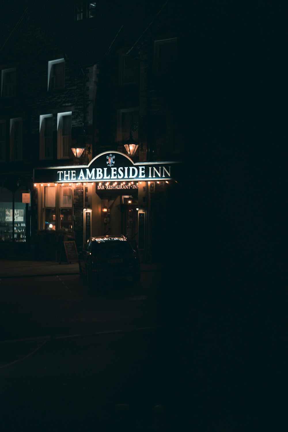 a street sign at night