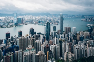 a large body of water with Victoria Peak in the background