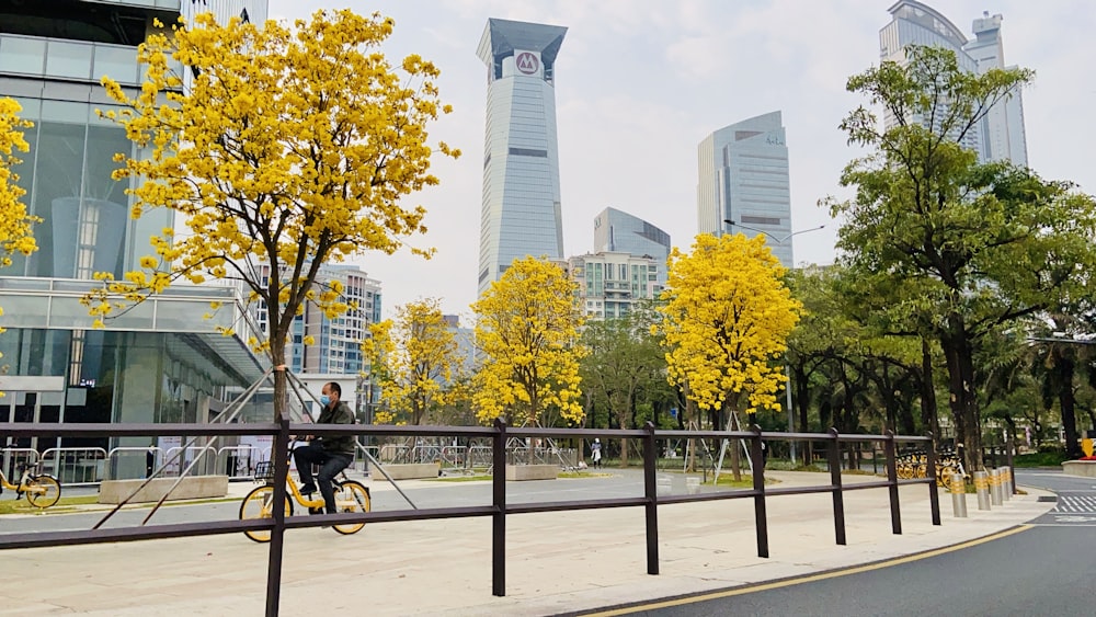 a person riding a bike on a city street