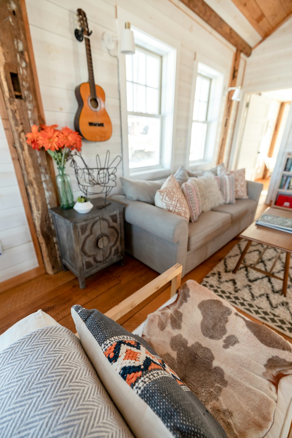 a living room filled with furniture and a fire place