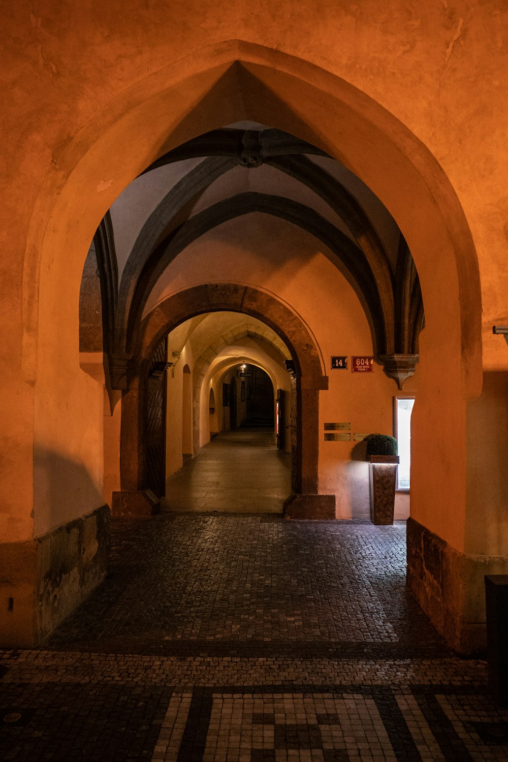 a long hallway with a clock on the wall