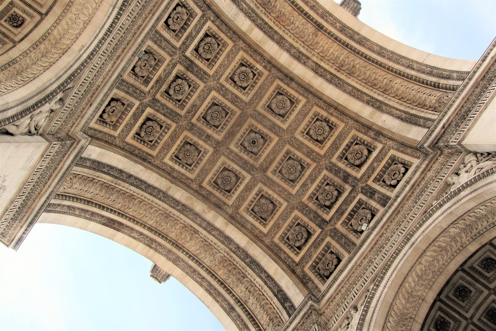 a close up of a building with a sky in the background