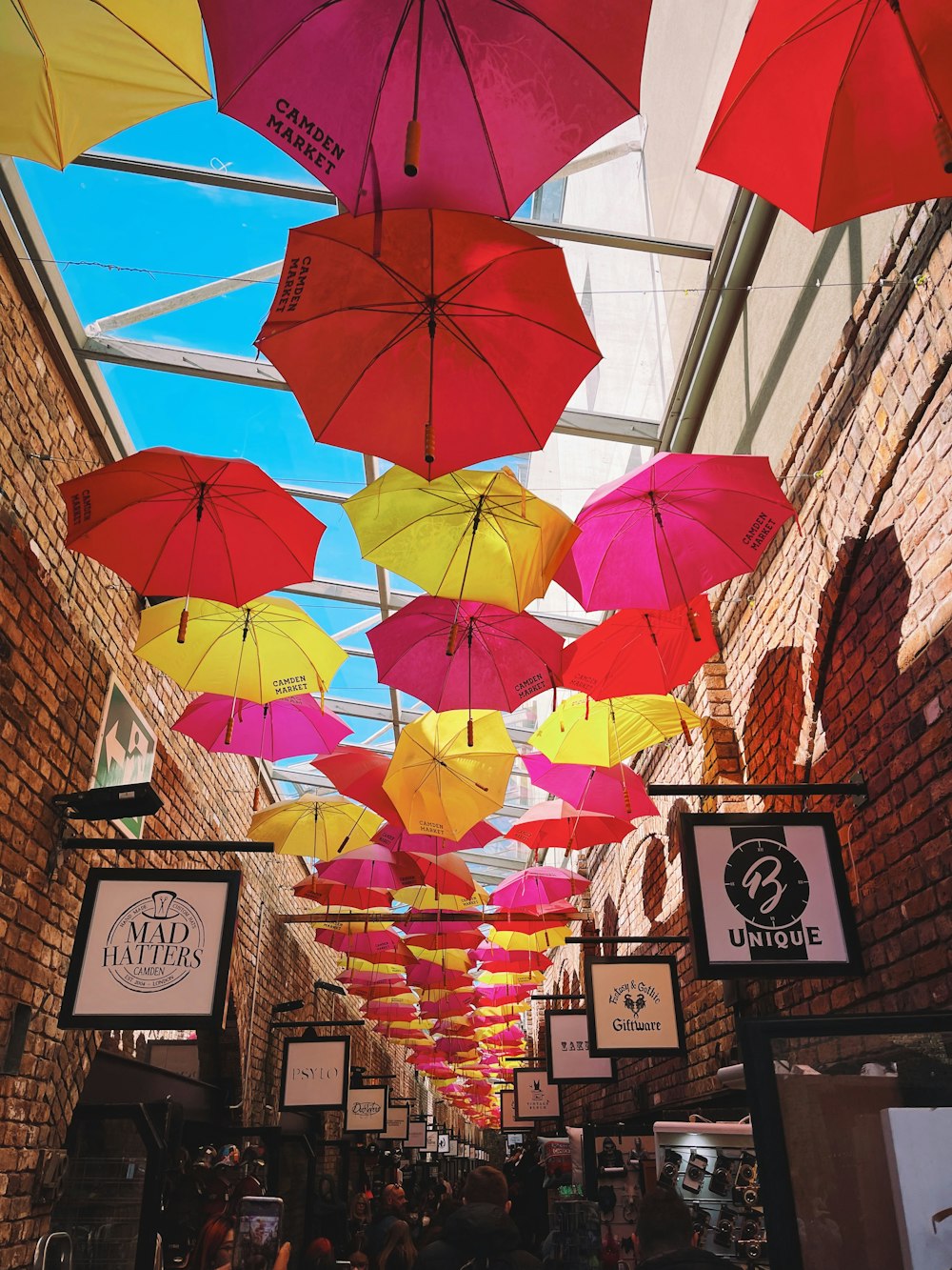 a group of umbrellas hanging from the ceiling of a building