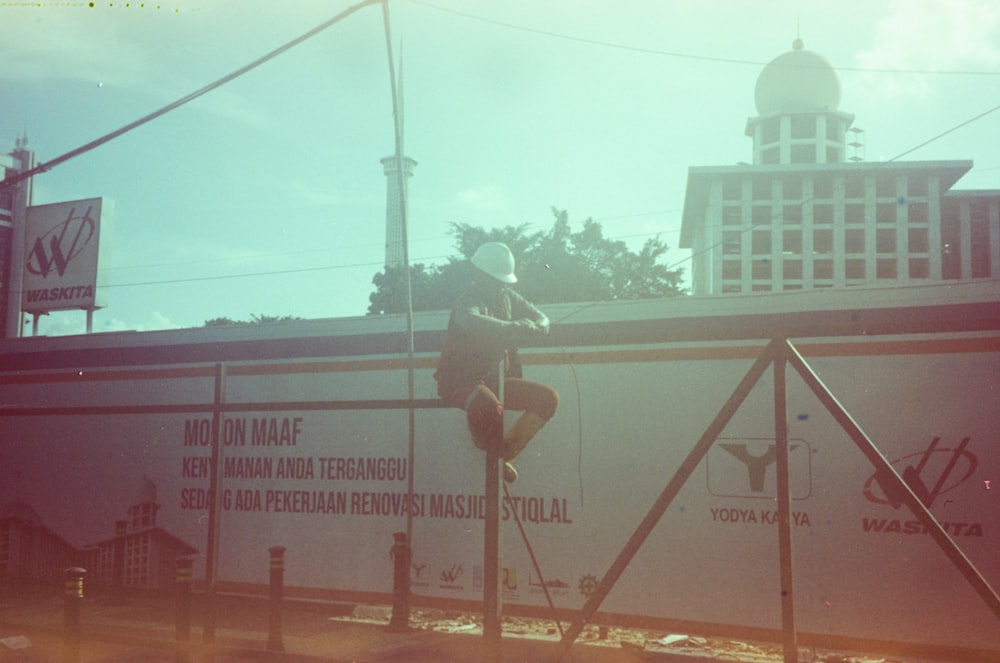 a man riding a skateboard down the side of a rail