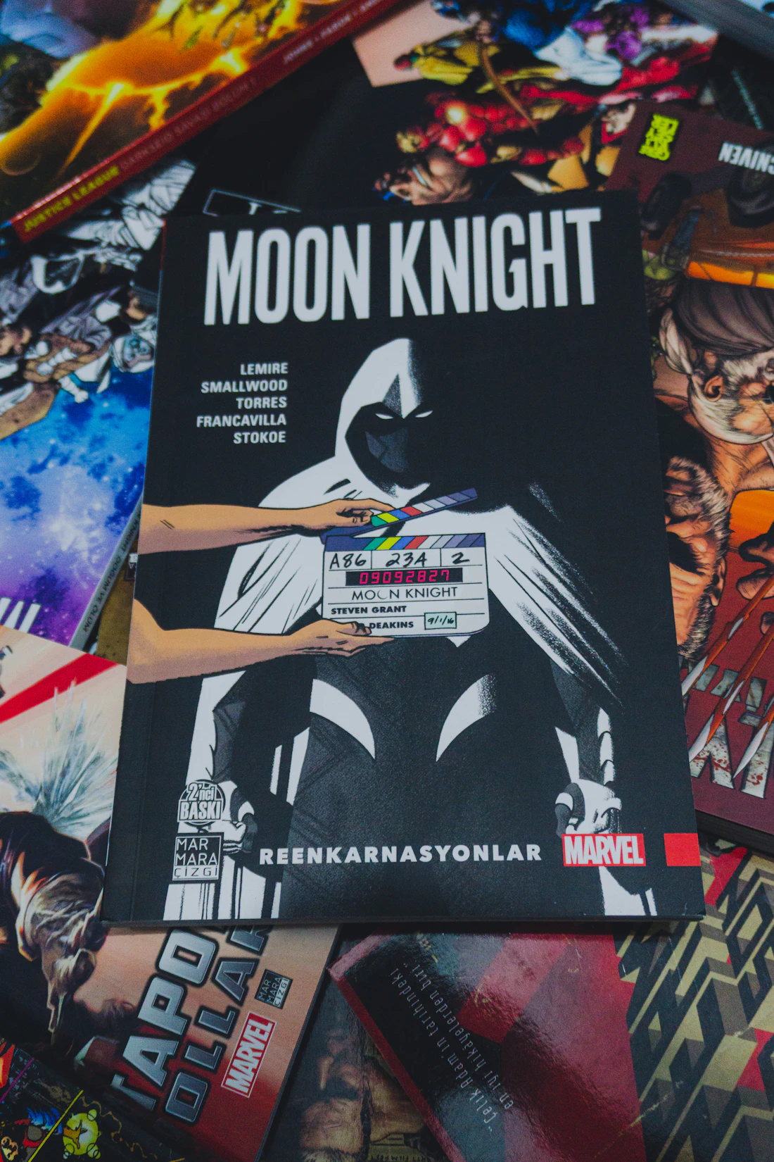 Stack of printed comic books on a table