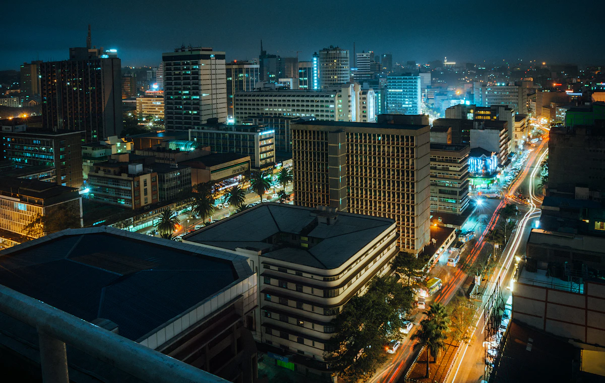 A view of a city at night from the top of a building