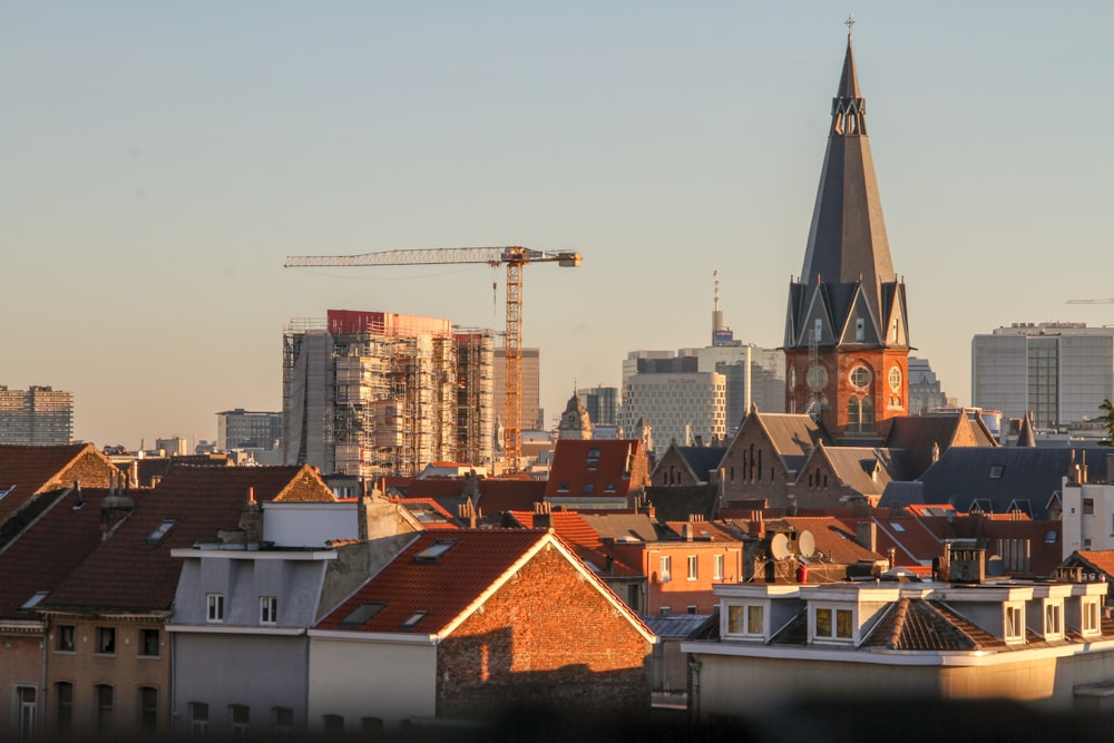 a view of a city skyline with a crane in the background