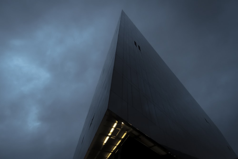 a very tall building with a sky in the background