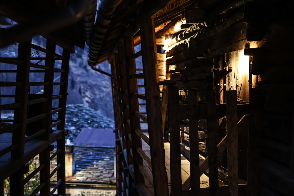 a wooden structure with a light on inside of it