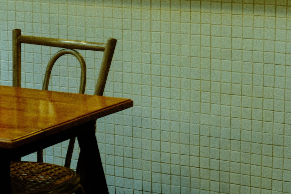 a wooden table with a wooden chair next to it