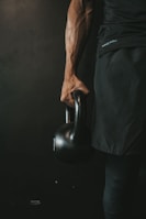 a man holding a kettle in his right hand
