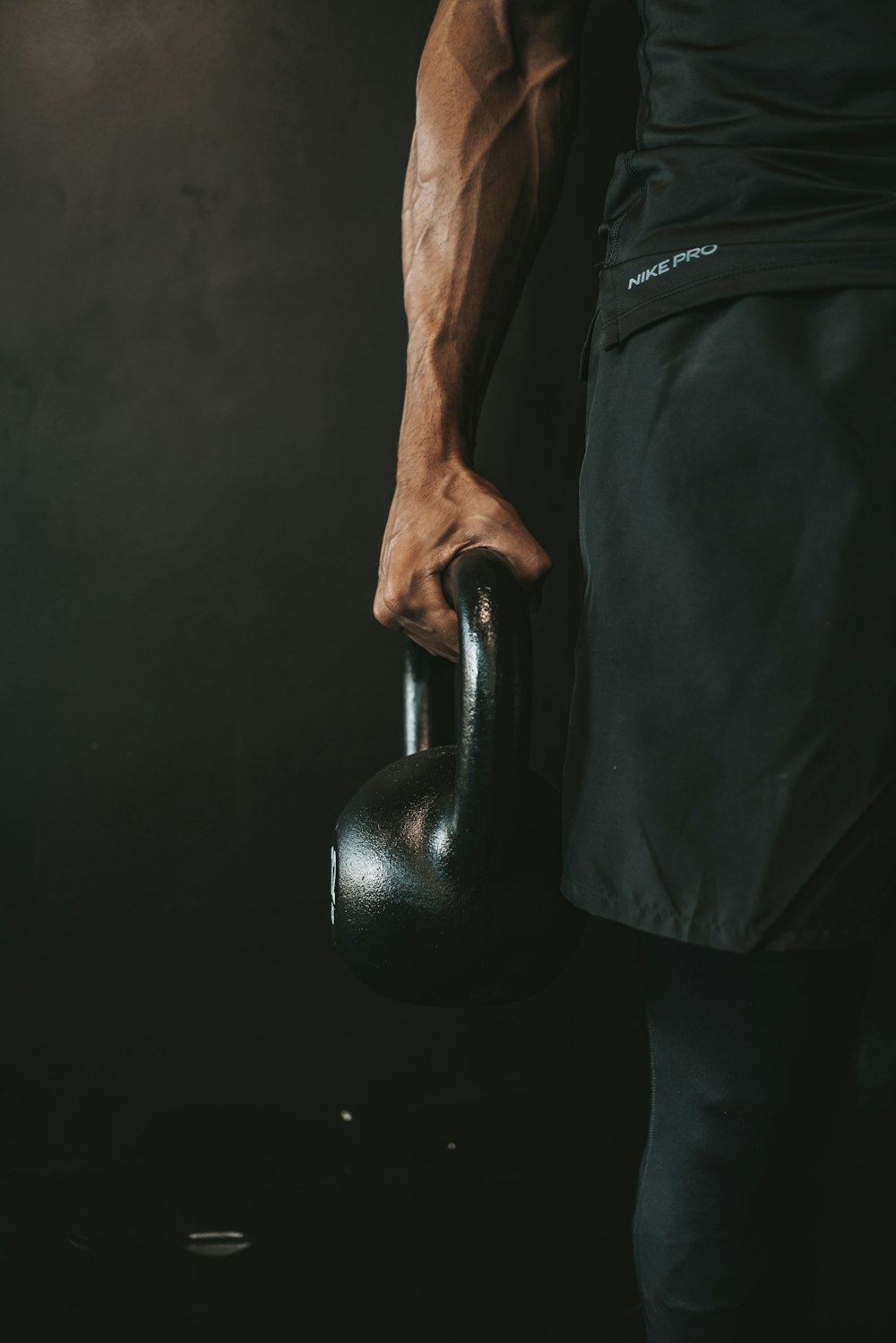 a man holding a kettle in his right hand