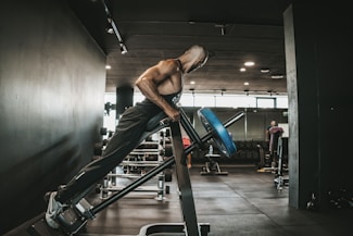 a man on a treadmill in a gym