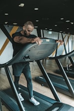 a man is running on a treadmill