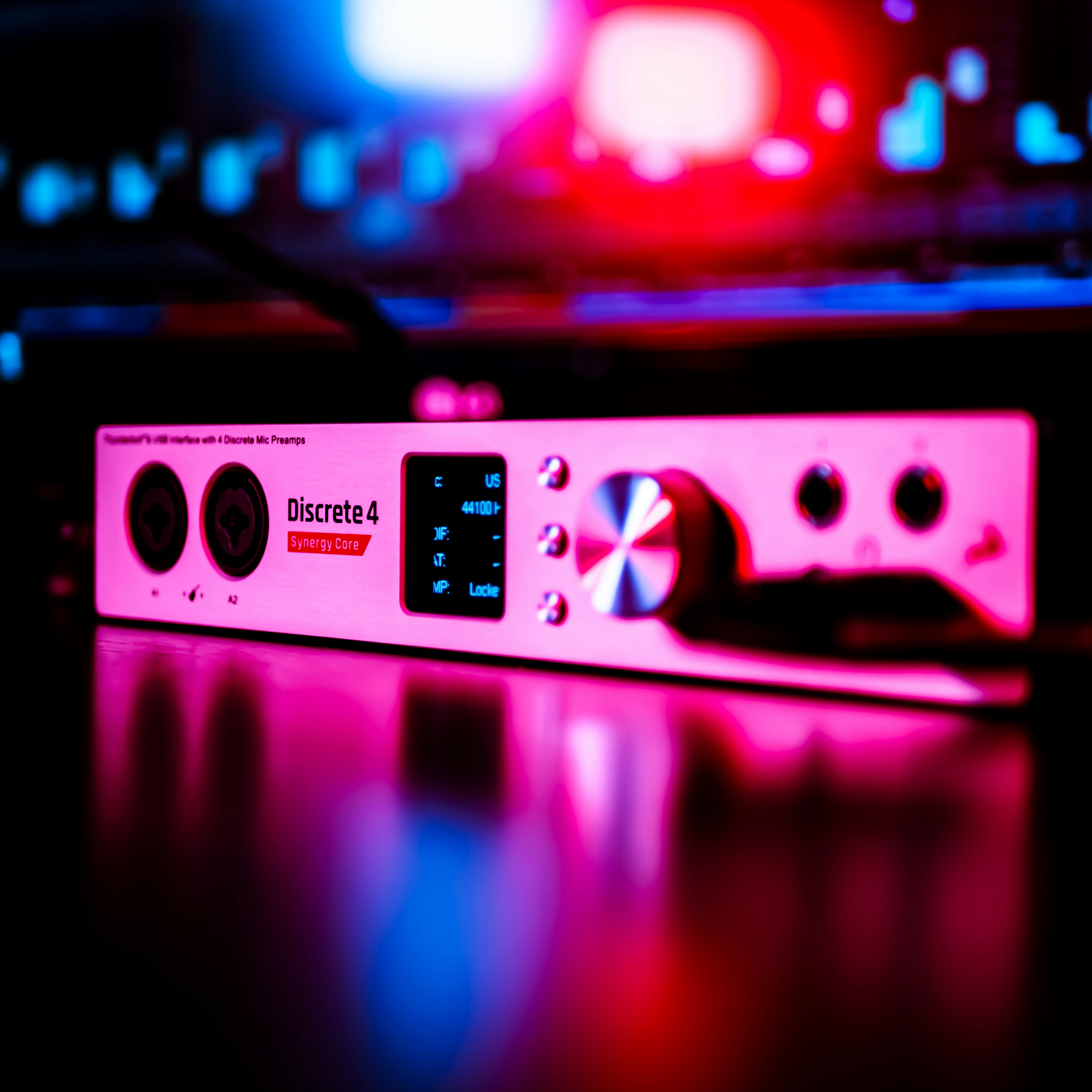 Audio Interface in a recording studio with red and blue neon lights with a cyberpunk style.