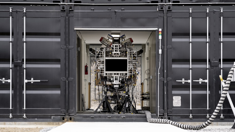 a black and white photo of a machine in a container