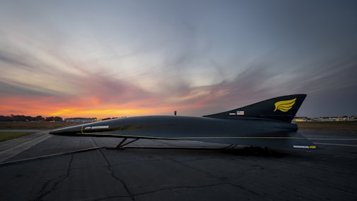 a jet sitting on top of an airport tarmac