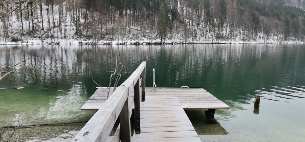 a wooden dock sitting next to a body of water