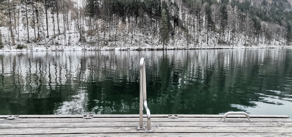 a wooden dock sitting next to a body of water