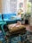 A cozy living room with a cat playing beside eco-friendly pet products.
