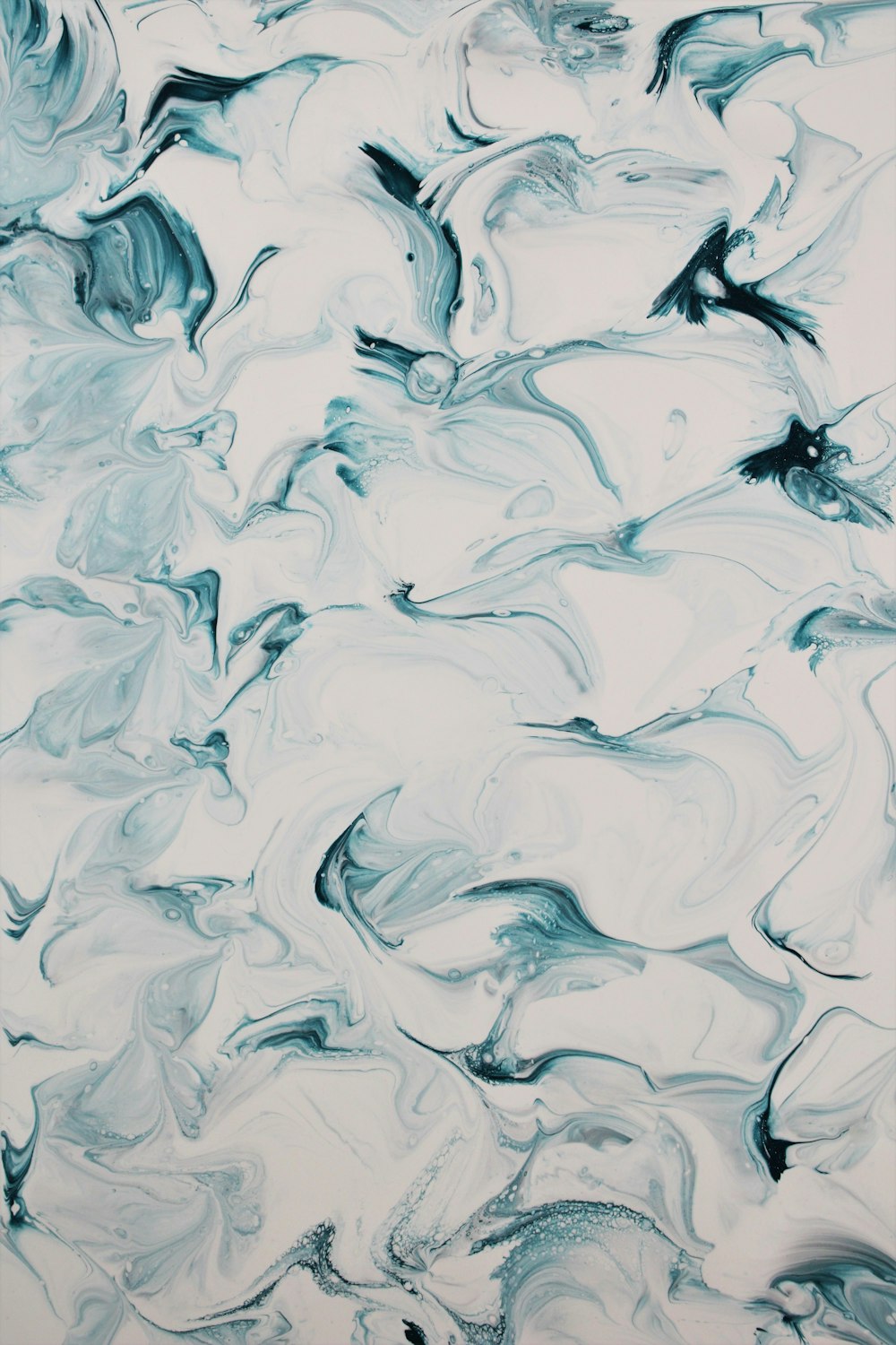 an abstract painting with blue and white colors