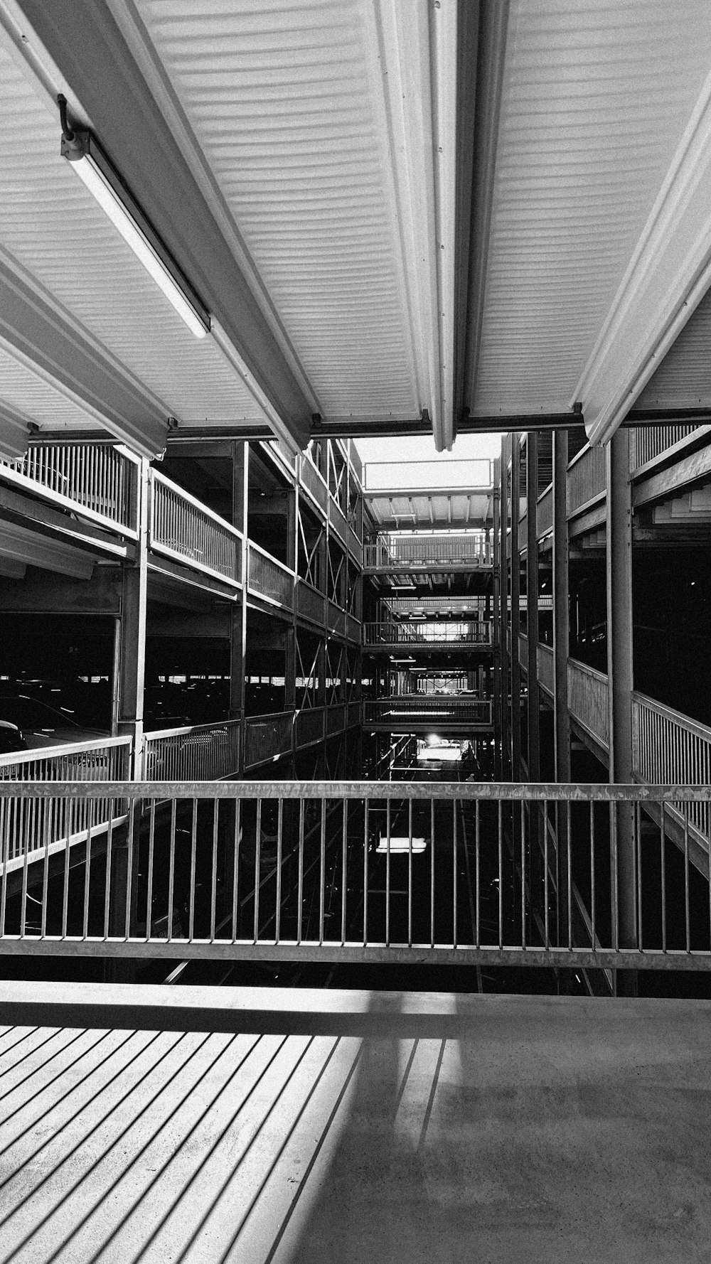 a black and white photo of a staircase in a building