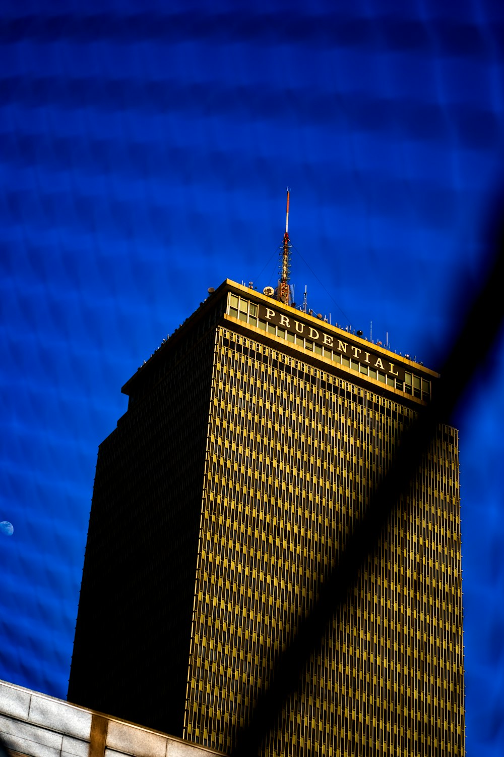 a very tall building with a sky background