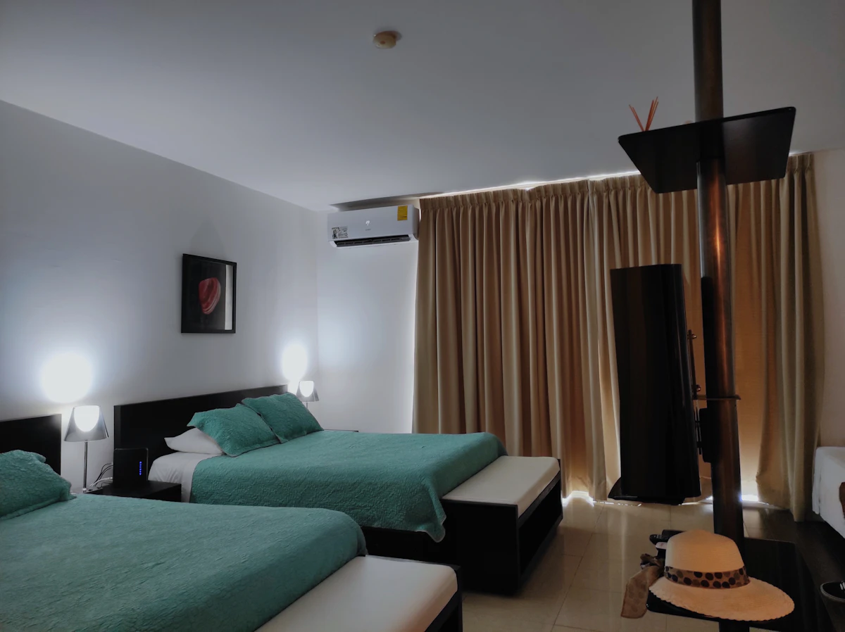 A hotel room with two beds