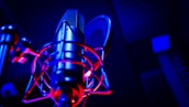 Close-up of professional microphone with studio lights.