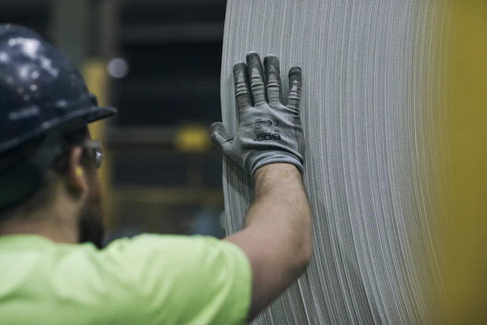 Worker handling materials on the floor