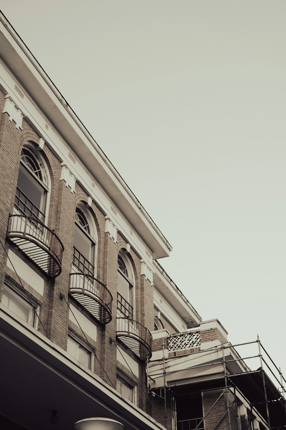 a tall brick building with balconies and balconies