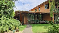 a house with a walkway leading to the front door