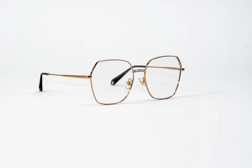 Grey framed eyeglasses on white surface