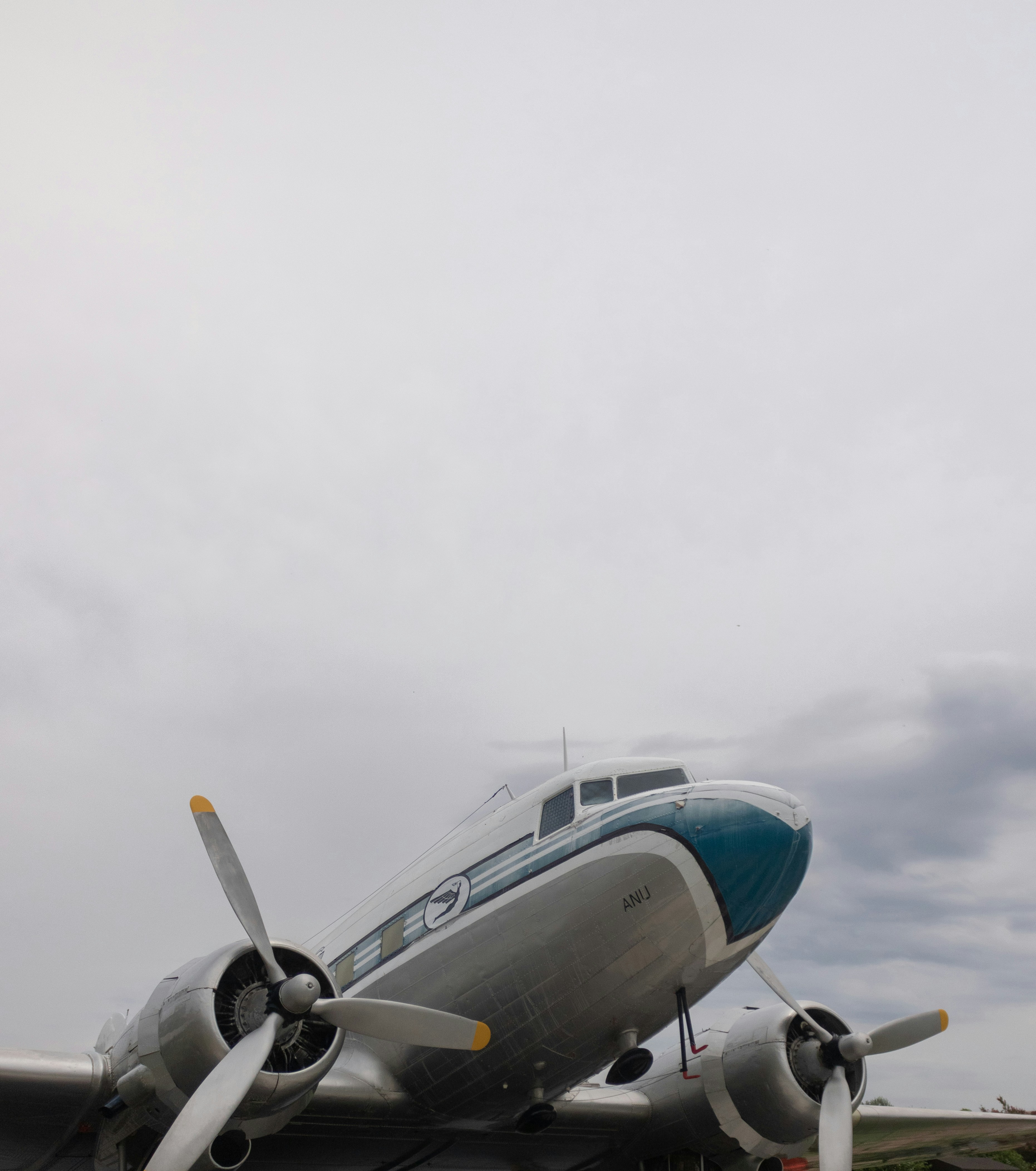 a propeller plane sitting on top of an airport tarmac