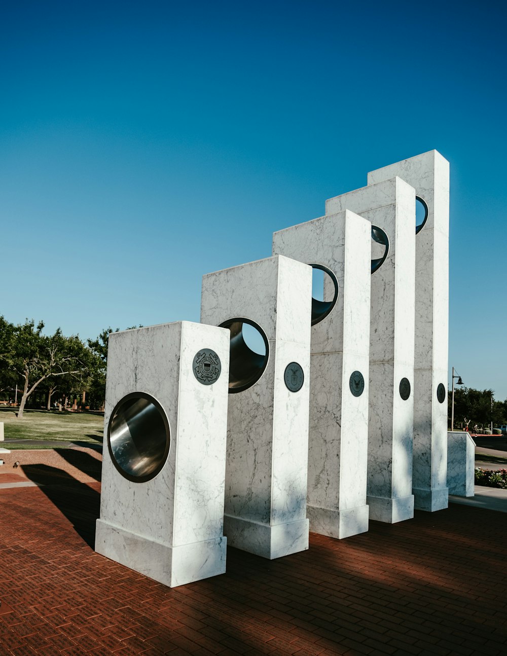 a group of cement sculptures sitting next to each other