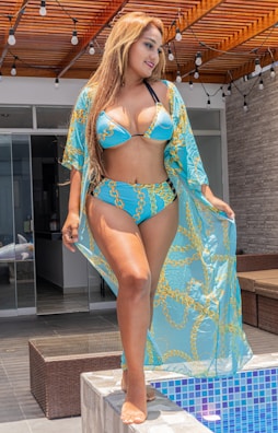 A stylish woman enjoying a luxurious hotel pool.