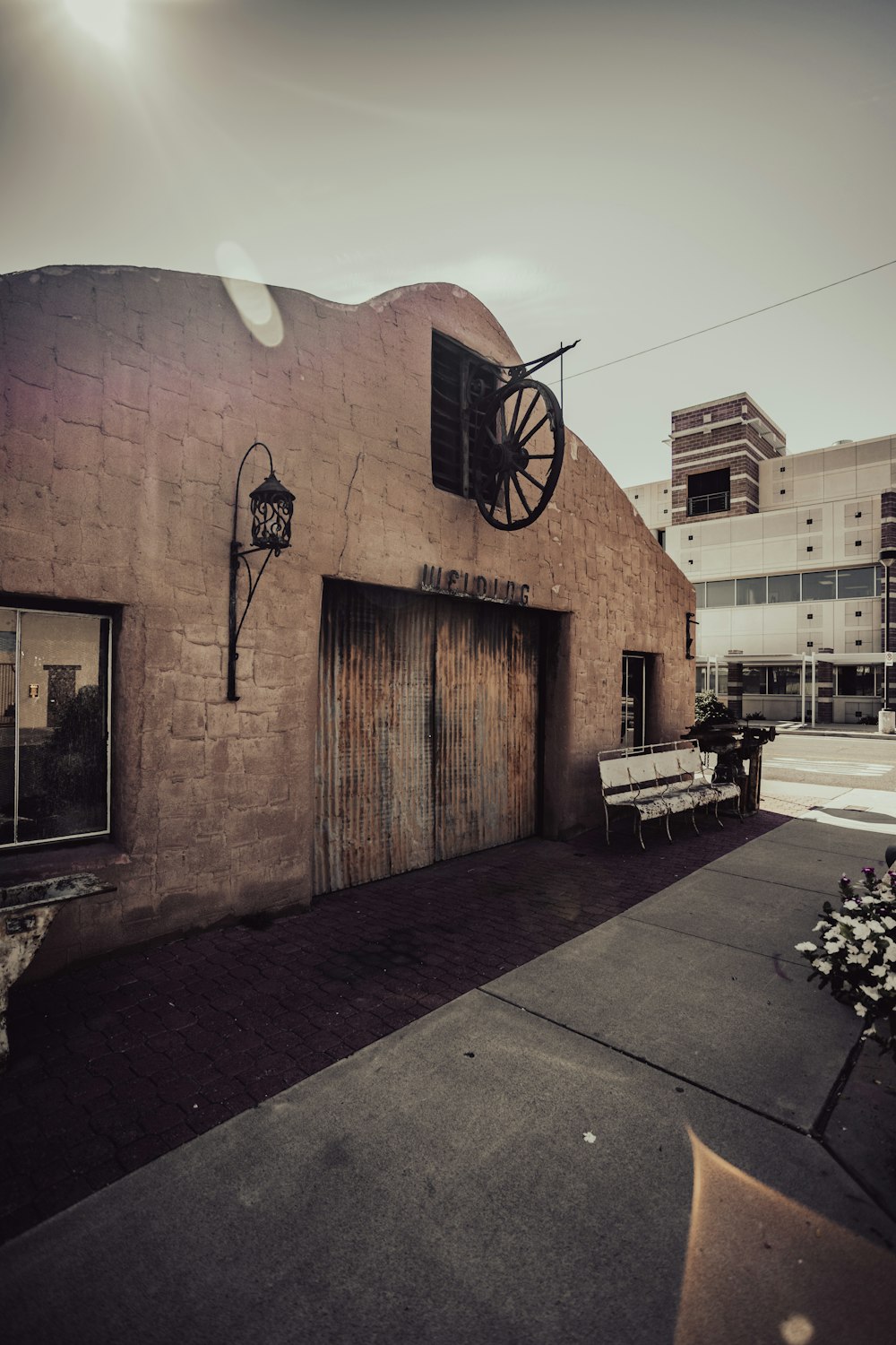 a building with a large wheel on the front of it