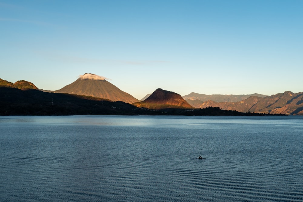 a person in a boat on a large body of water