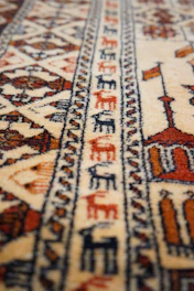 Elegant Turkish carpet featuring geometric patterns in warm earth tones.