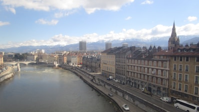 a river running through a city next to tall buildings