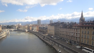 a river running through a city next to tall buildings