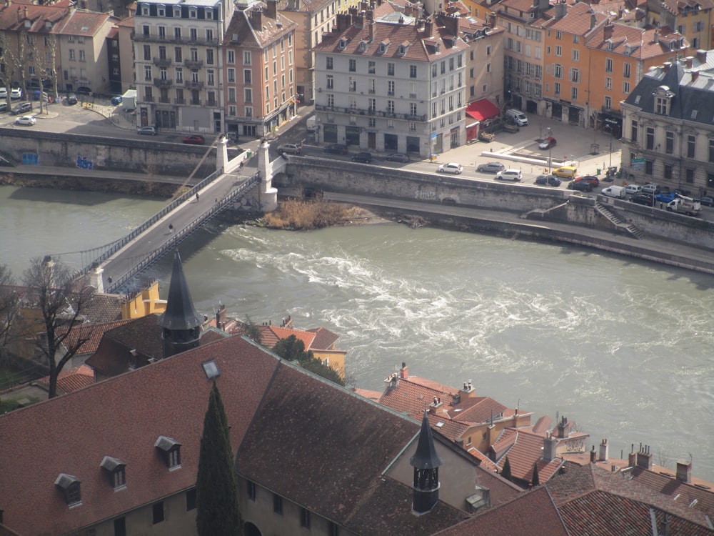 a river running through a city next to tall buildings