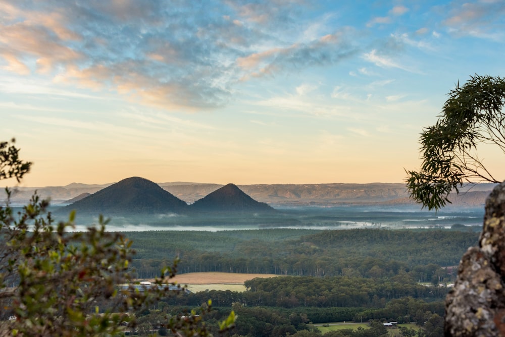 a view of a valley with mountains in the distance